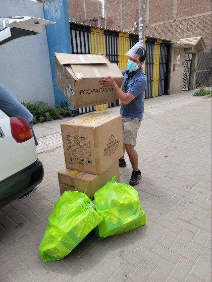 Jonathan picking up the first batch of masks from the closest city