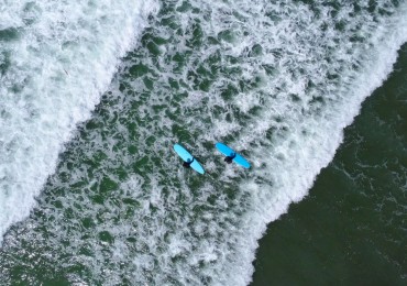 The consistent, powerful whitewash at Cox Bay will get beginner surfers popping to their feet in no time.