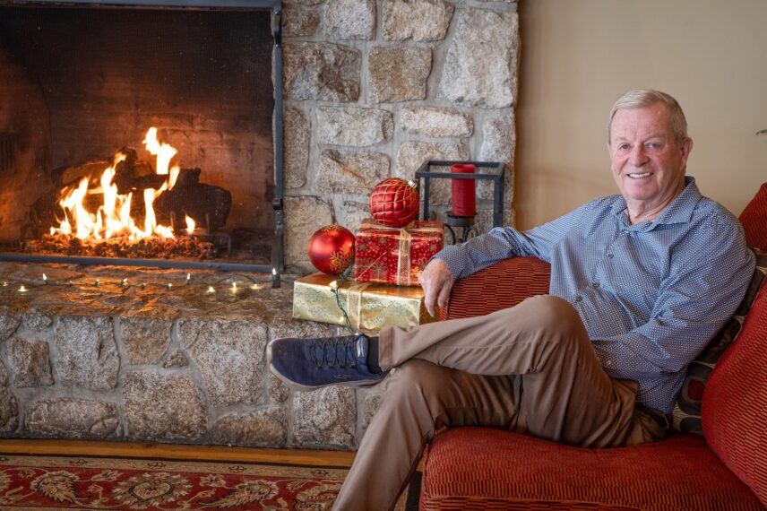 Tim Hackett in front of the fireplace in the Great Room