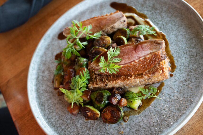 Duck dish served with vegetables