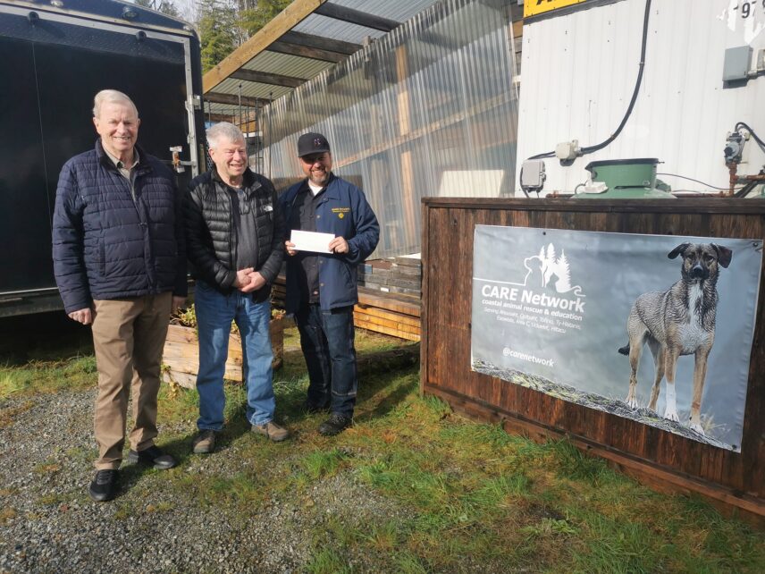 Owner Tim Hackett and his brother Tony Hackett presenting a donation cheque during a visit to the CARE Network.