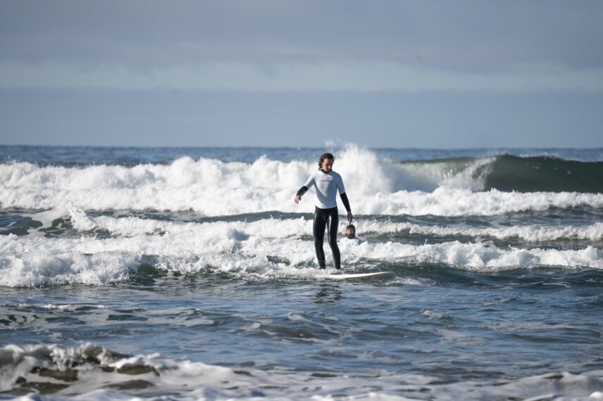 Surfer in the water on Cox Bay